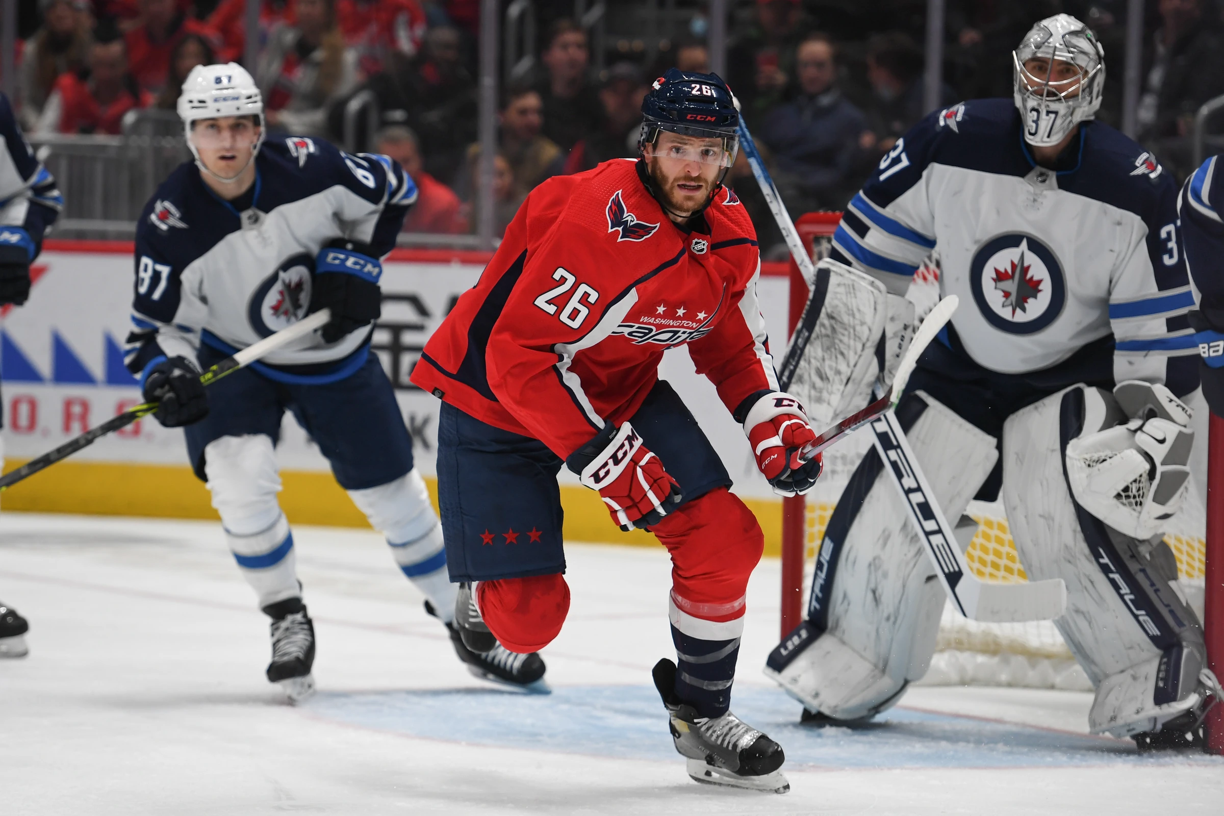 Connor Hellebuyck and Winnipeg Jets teammates