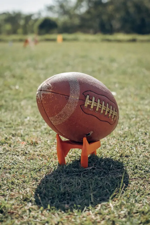 American football on a kicking tee; illustrative photograph