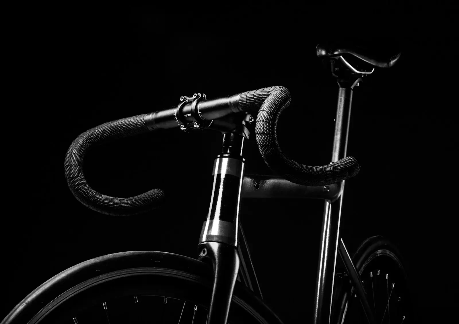 Bicycle drop handlebars and front wheel; illustrative photograph