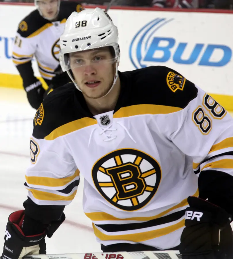 David Pastrnak wearing Boston Bruins colours