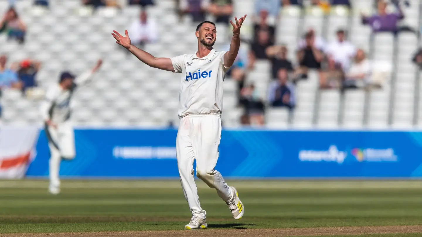 Ethan Bamber celebrates Warwickshire's County Championship win