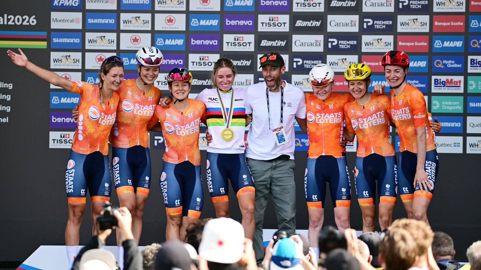 Demi Vollering celebrates with her team after the world road race