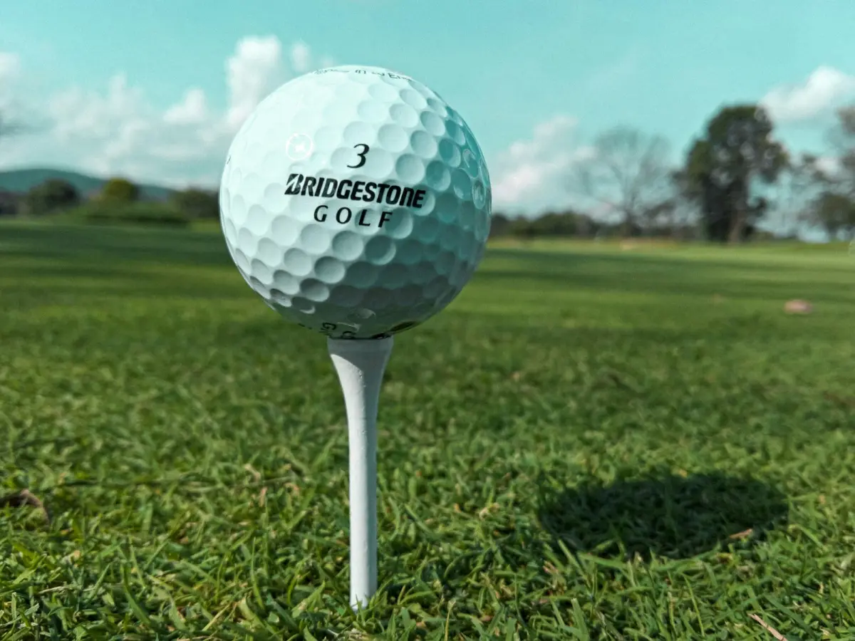 Golf ball on a tee; illustrative photograph