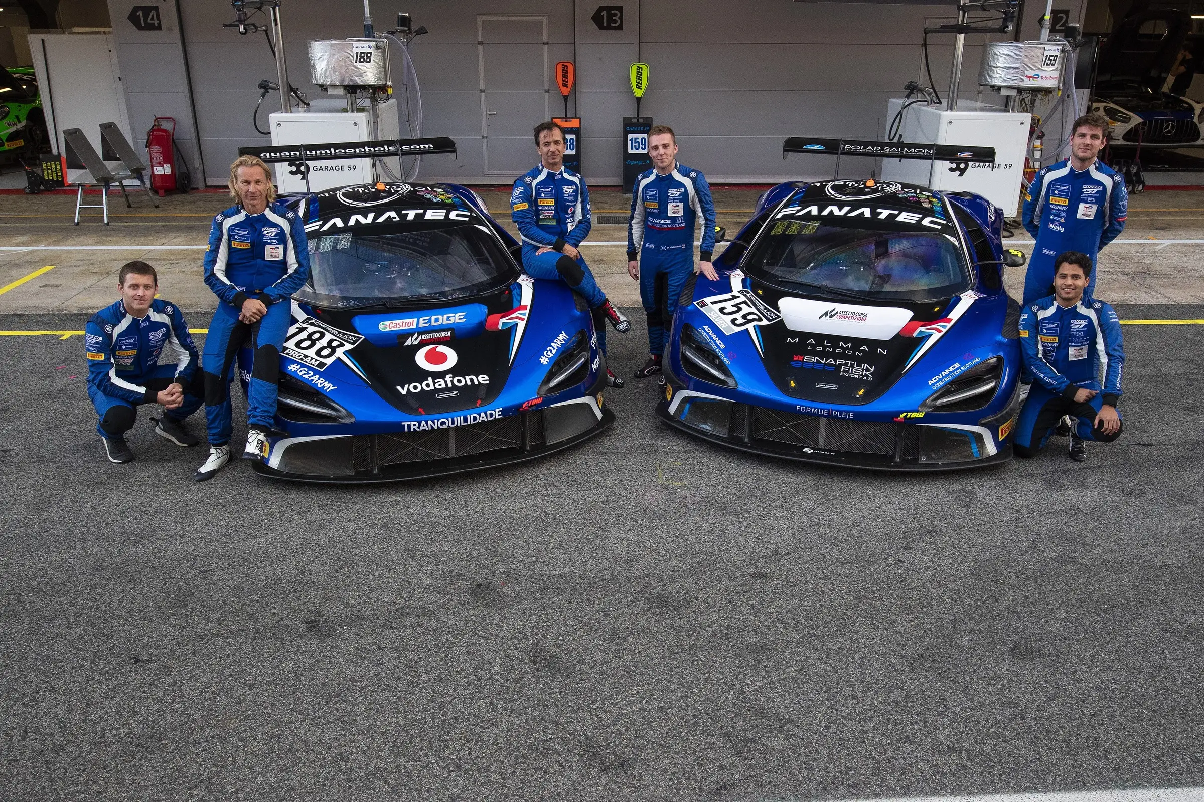 Garage 59 drivers and team members at a GT endurance event