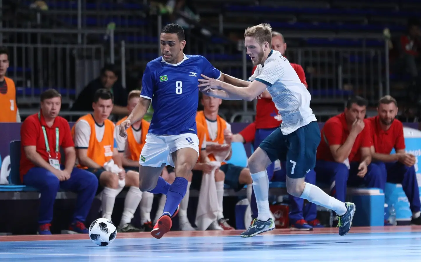 Brazil competing against Russia in an international youth futsal match