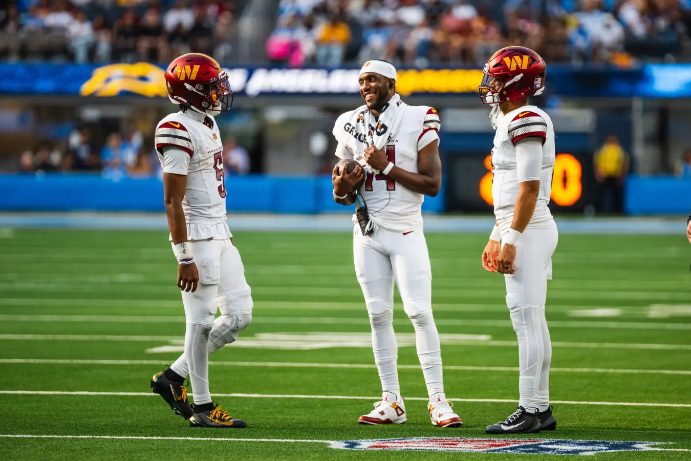 Marcus Mariota with Washington Commanders teammates before an NFL game