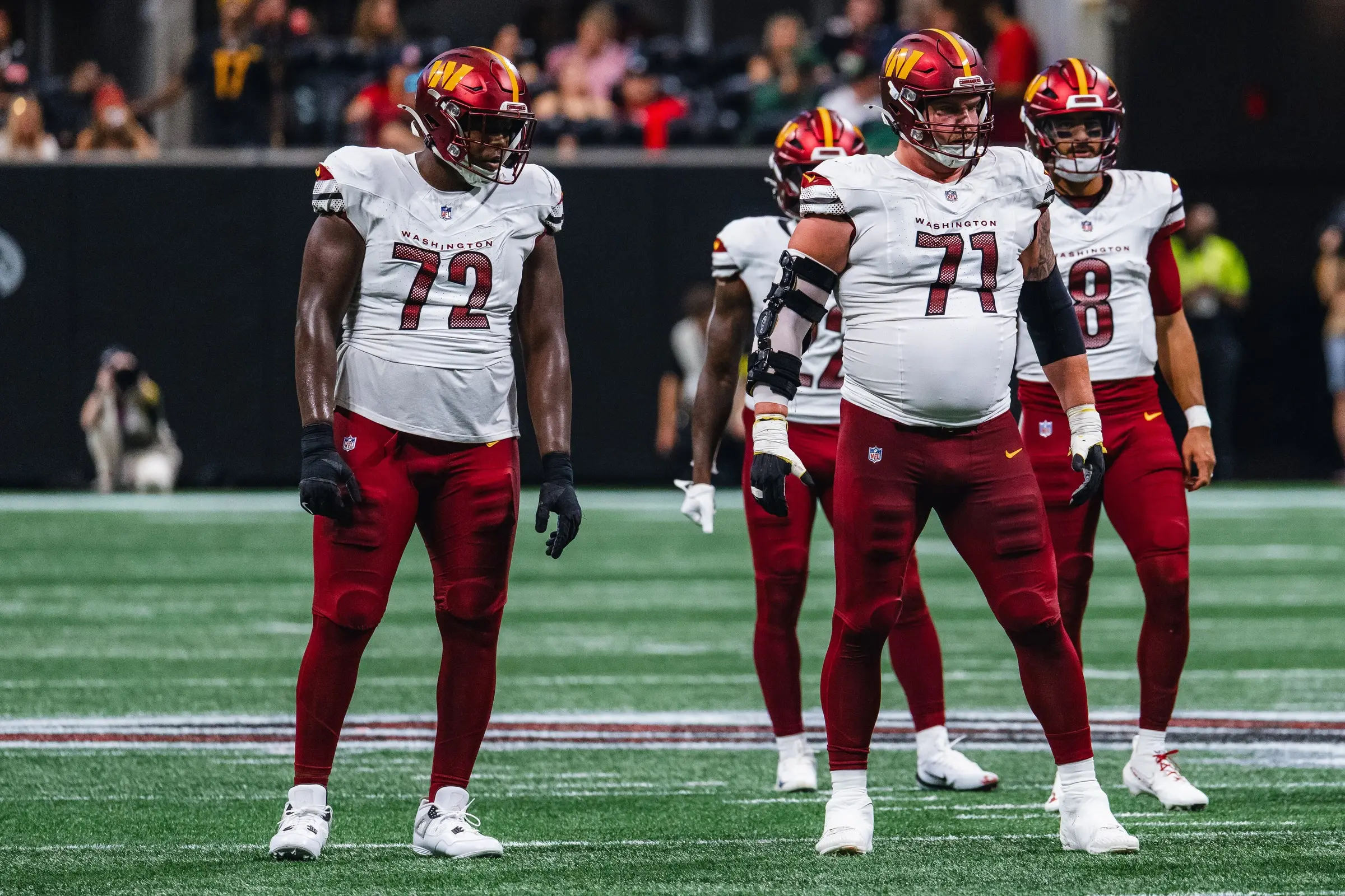 Washington Commanders offensive players, including Marcus Mariota, during an NFL game