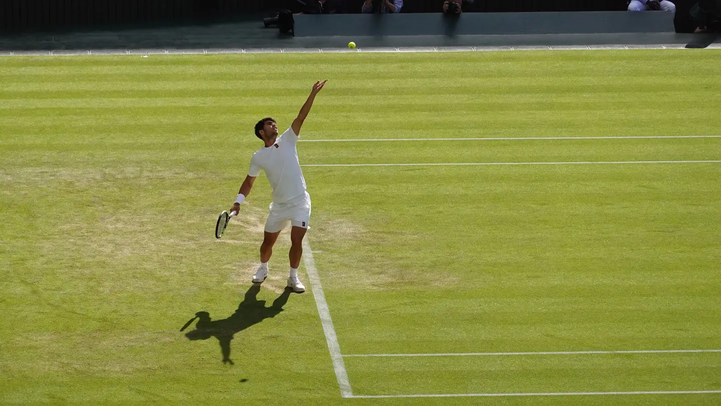 Carlos Alcaraz serving during his match against Jan-Lennard Struff at Wimbledon