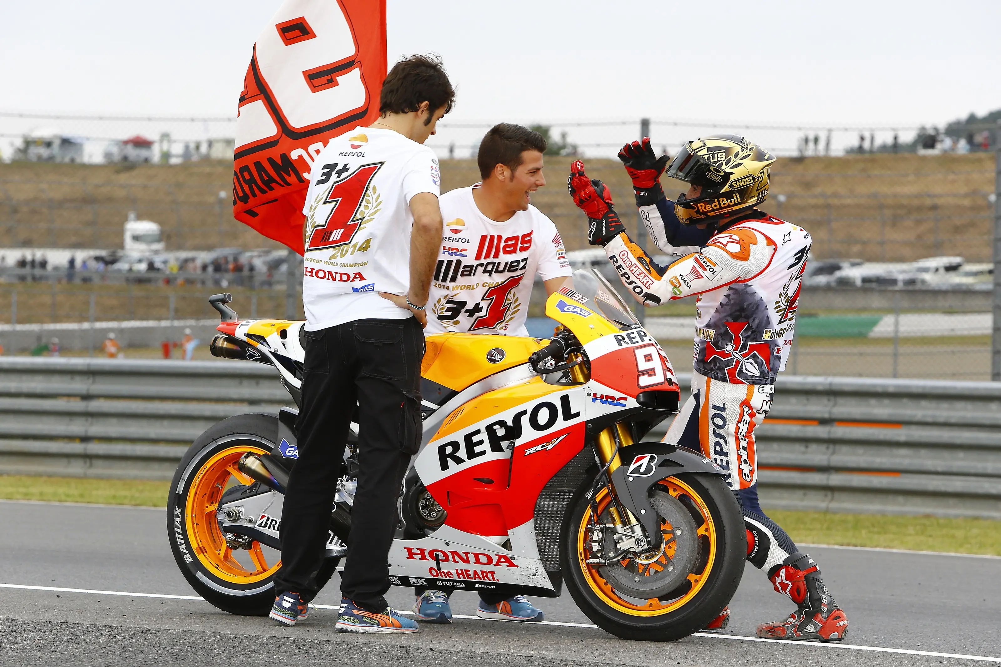 Marc Marquez beside his motorcycle after racing at Motegi