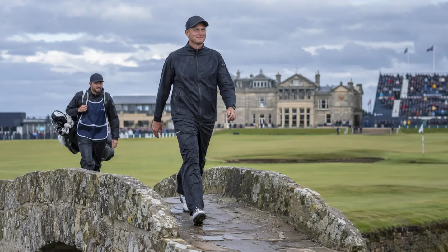 AI-generated editorial reconstruction of Adrian Meronk crossing the Swilcan Bridge after winning at St Andrews