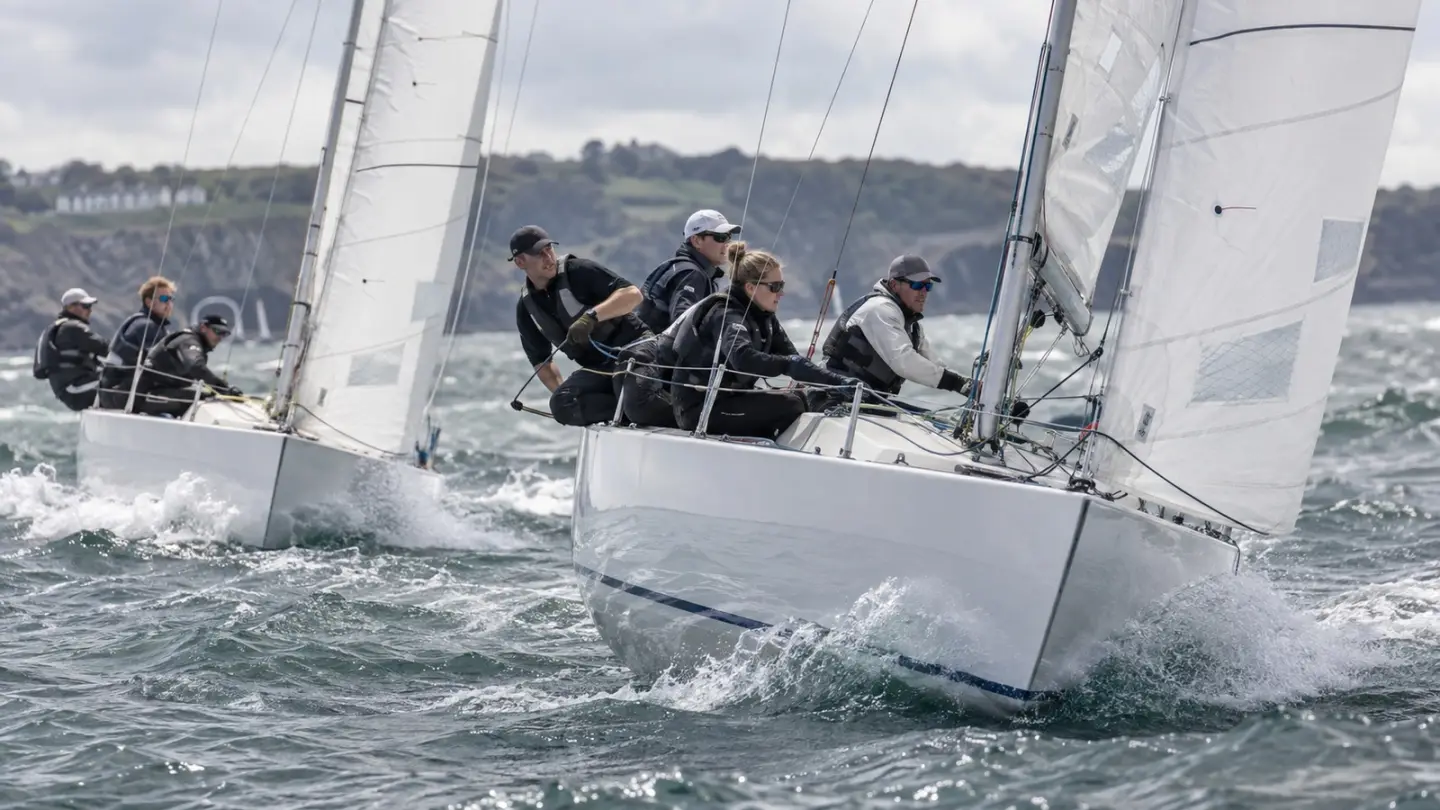 AI-generated editorial reconstruction of Monarch racing a rival 707 keelboat