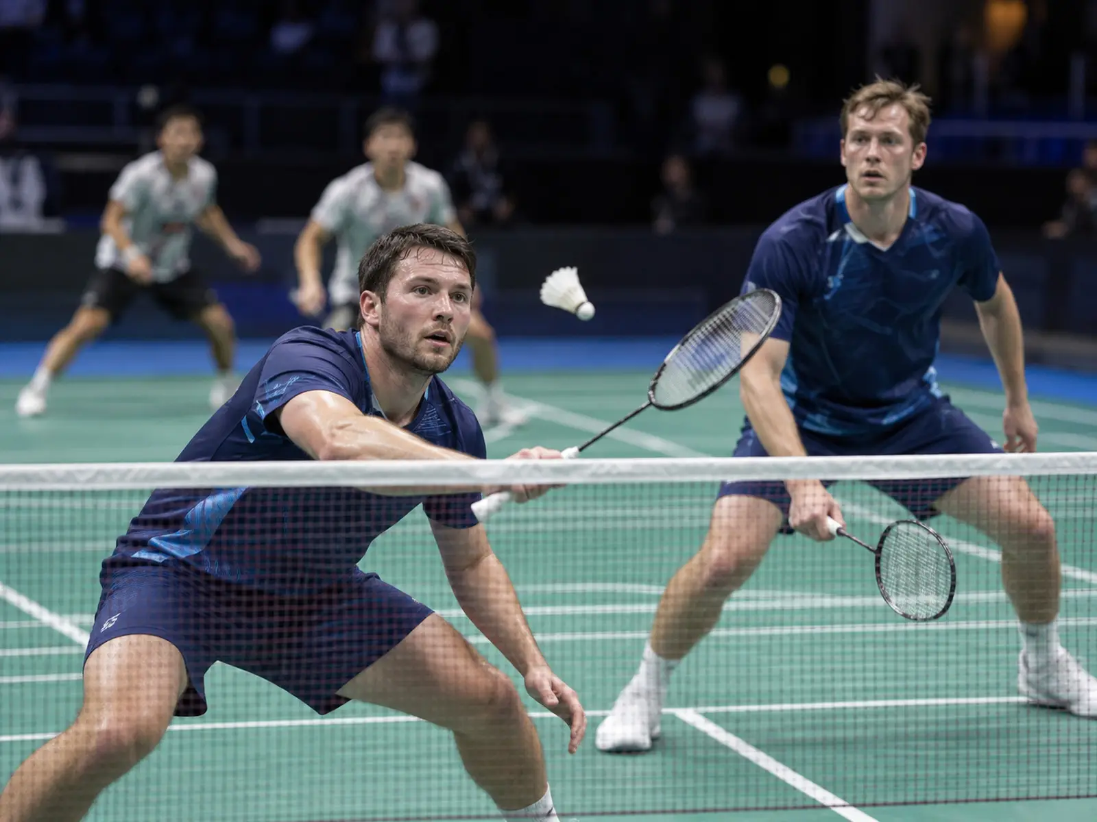 AI-generated editorial men’s doubles badminton scene; not the Scottish players or their actual match