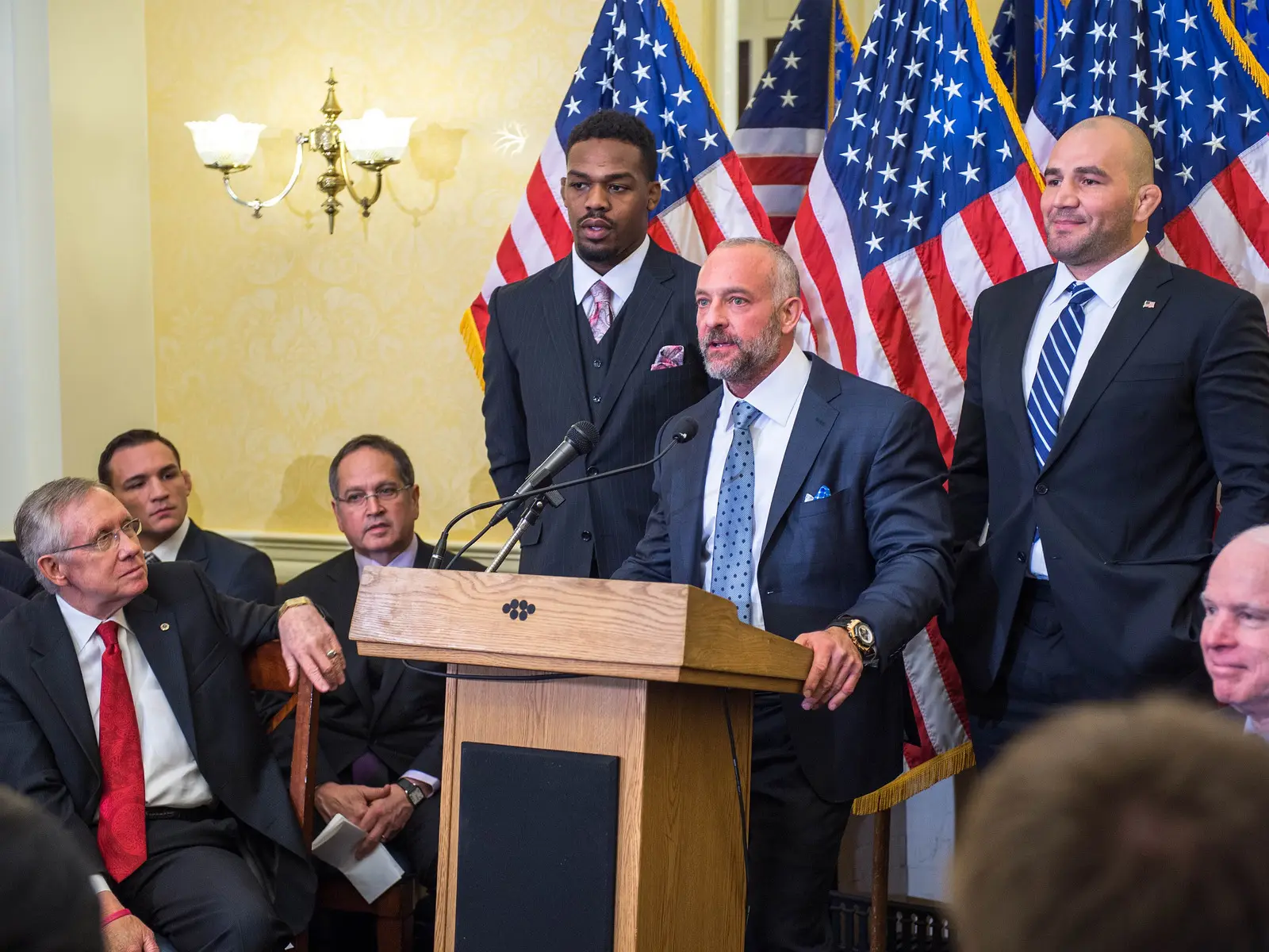 Jon Jones alongside Lorenzo Fertitta and Glover Teixeira at a 2014 event