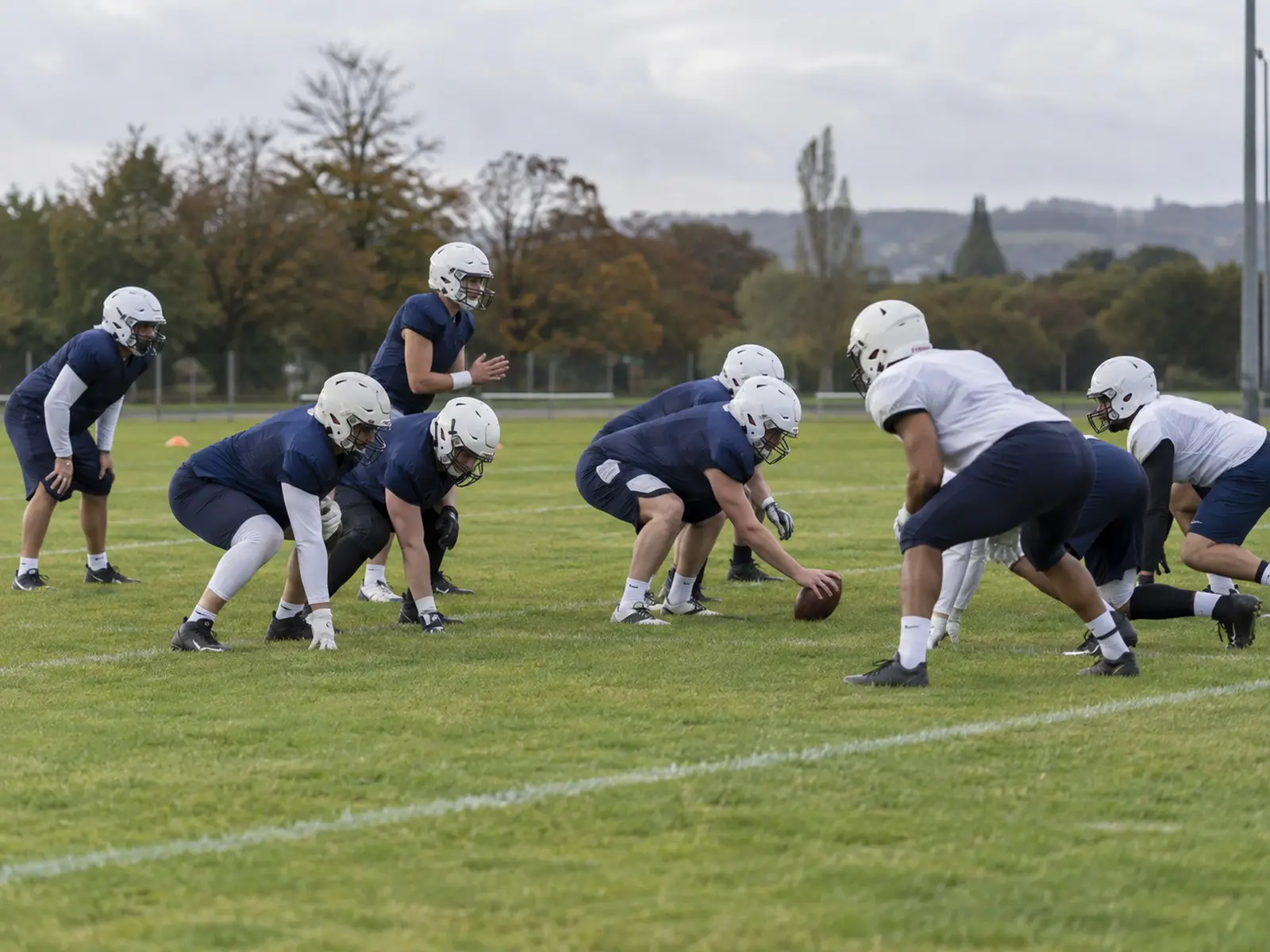 Conceptual image of anonymous American football players training in formation; AI-generated illustration, not the Great Britain squad or Georgia match