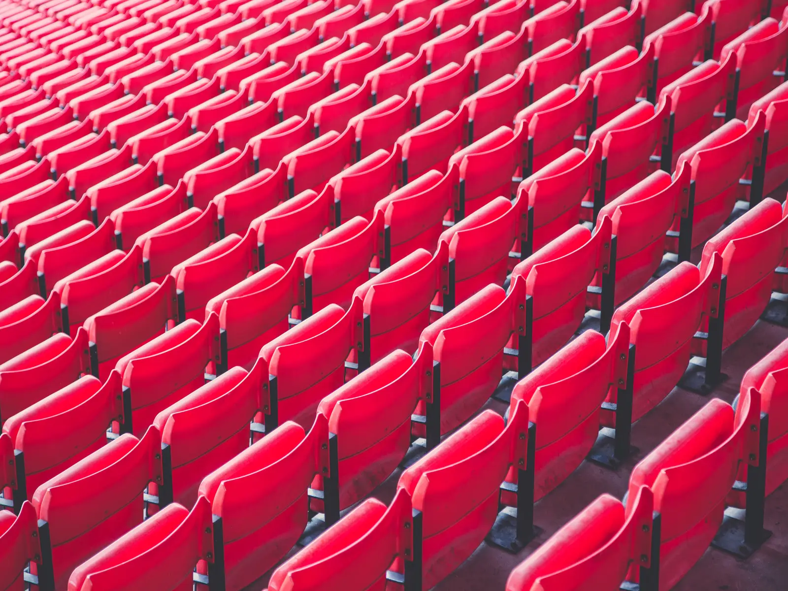 Archive photograph of red seats at Anfield; not the Manchester City–Liverpool match